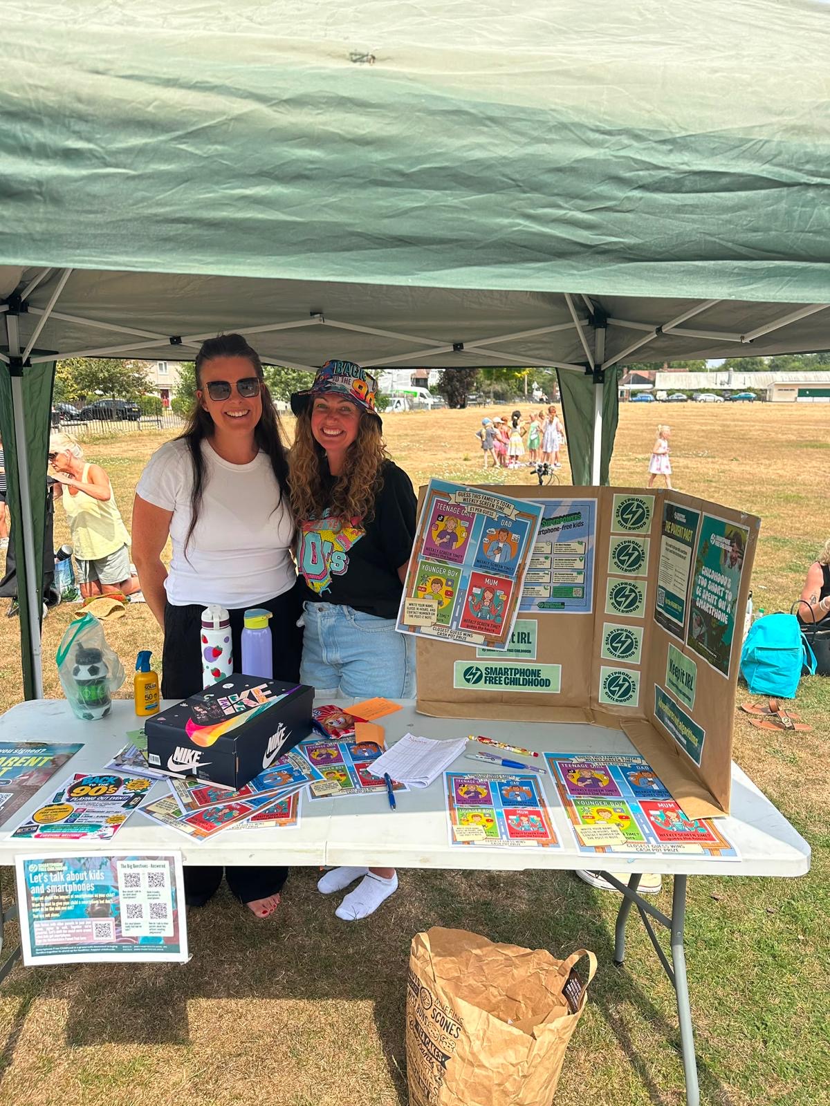 Dani and Tash at the Smartphone-Free Childhood stand